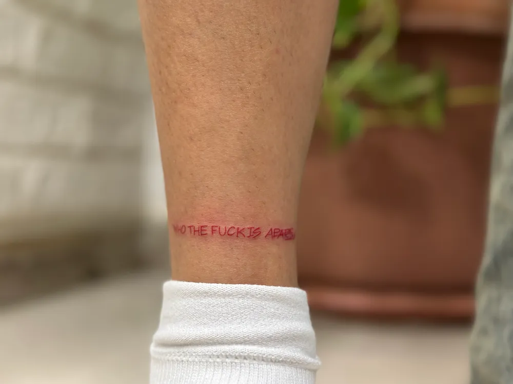 Fine-Line Floral Outline Tattoo