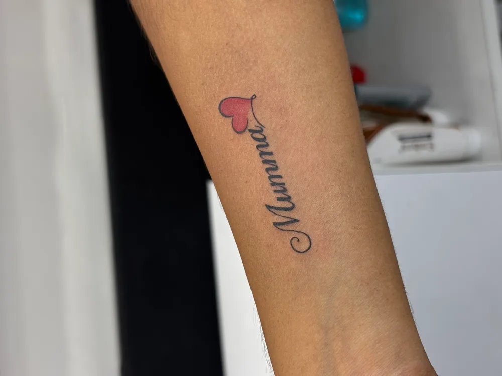 Botanical fine-line tattoo in South Pune